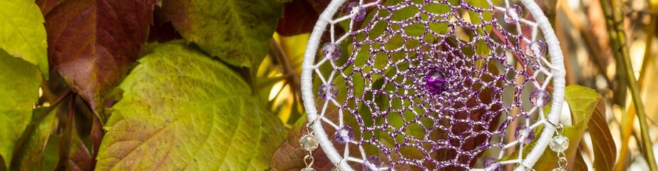 Banner of Handmade dream catcher with feathers threads and beads rope hanging