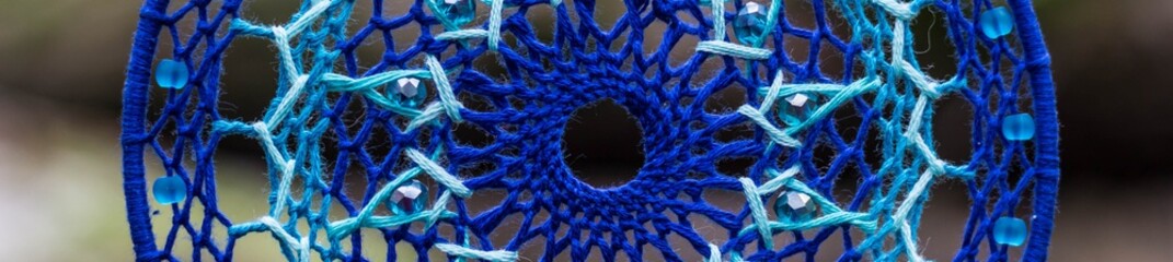 Banner of Dreamcatcher made of feathers, leather, beads, and ropes