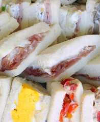 big sandwiches with salami and bolied eggs