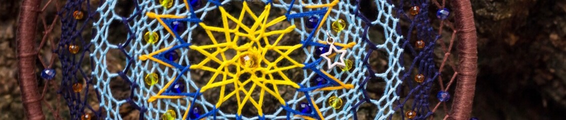 Banner of Handmade dream catcher with feathers threads and beads rope hanging