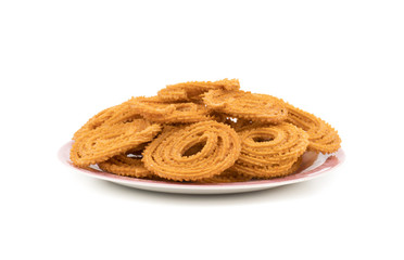Indian Traditional Snack Chakli, a spiral shaped crisp deep fried snack, It is known as  Chakali, Murukku, Muruku, Murkoo, Chakri in Gujarat, Chakli in Maharashtra and Northern India