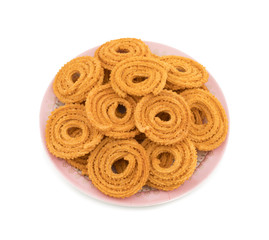 Indian Traditional Snack Chakli, a spiral shaped crisp deep fried snack, It is known as  Chakali, Murukku, Muruku, Murkoo, Chakri in Gujarat, Chakli in Maharashtra and Northern India