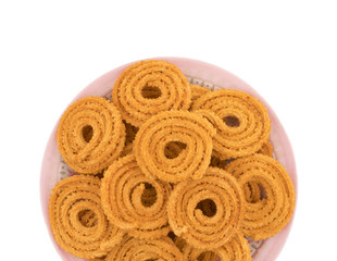 Indian Traditional Snack Chakli, a spiral shaped crisp deep fried snack, It is known as  Chakali, Murukku, Muruku, Murkoo, Chakri in Gujarat, Chakli in Maharashtra and Northern India