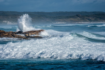 surf crashing over rocks, West Point Reserve