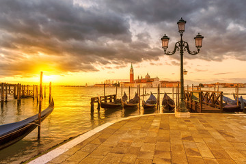 Venice Sunrise. San Marco square with gondolas in morning, Grand Canal, Venice, Italy.