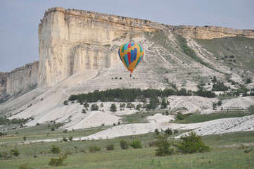 Multicolored balloon near the White rock in spring © vitaliiaberestok