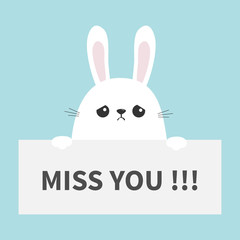 White sad bunny rabbit hanging on paper board Miss you. Funny head face. Big ears. Cute cartoon character. Kawaii animal. Easter symbol. Baby card. Pet collection. Flat design. Blue background