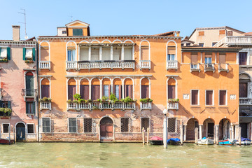 Naklejka premium Picturesque summer view of Venice with famous water canals and colorful historical buildings.