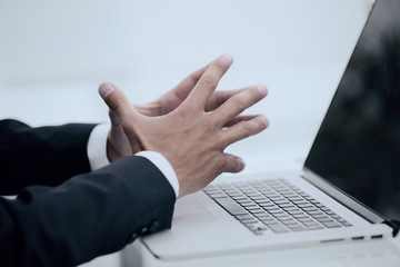 closeup.businessman looking at the laptop screen.