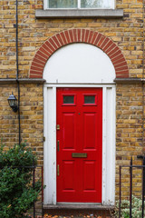 London, UK - beautiful typical red Georgian wooden front door