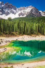 Naklejka na ściany i meble Beautiful and blue mountain Carezza lake in Dolomites, Italy