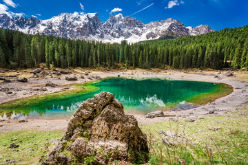 Stunning and blue mountain Carezza lake in Dolomites, Italy
