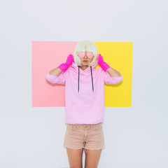 Blonde Girl Model in Fashion accessory sunglasses, gloves,  hoodie and shorts. Club DJ Party Fun....