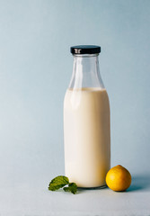Milk bottle and lemon