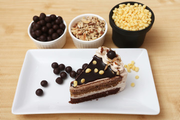 Milk and chocolate cake with chocolate ball and crispy