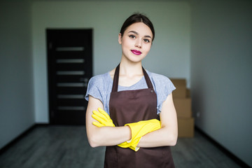 Young beautiful woman with protective gloves at home. Cleaning concept