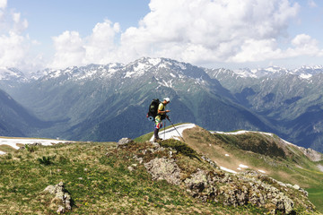 Man traveler backpacker with GPS navigator tracker looking for coordinates.