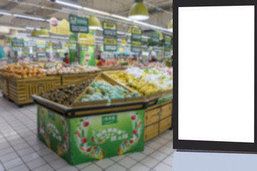 The background of the blurred mall in the foreground for the advertising light box