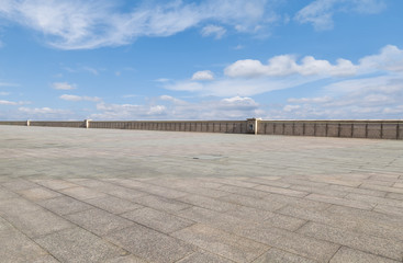 Empty square floor tiles and beautiful sky landscape