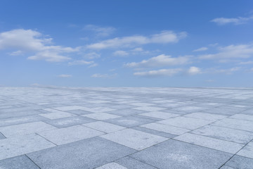 Empty square floor tiles and beautiful sky landscape