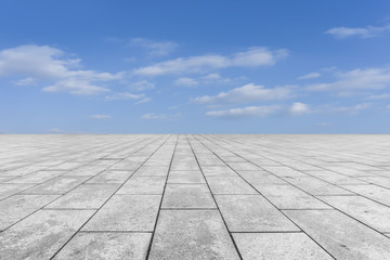 Empty square floor tiles and beautiful sky landscape