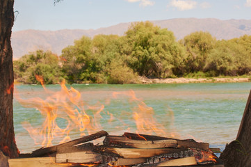 Naklejka premium fire by the river