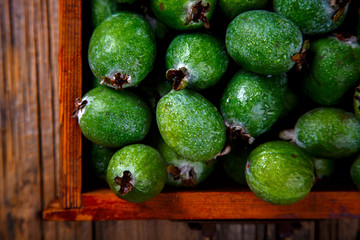 Feijoa Fruits. Fresh ripe sweet .Tropical fruit. Background of green color.Food or Healthy diet concept.Super Food.Vegetarian.Top View.Copy space for Text.selective focus.