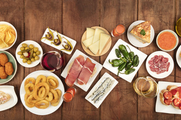 Spanish tapas food on dark background with place for text