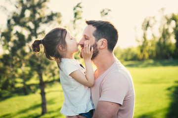 Father hugs his dauhter.