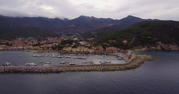 Aerial, a little port of Marciana Marina on Elba island in Tuscany, Italy on a cloudy day