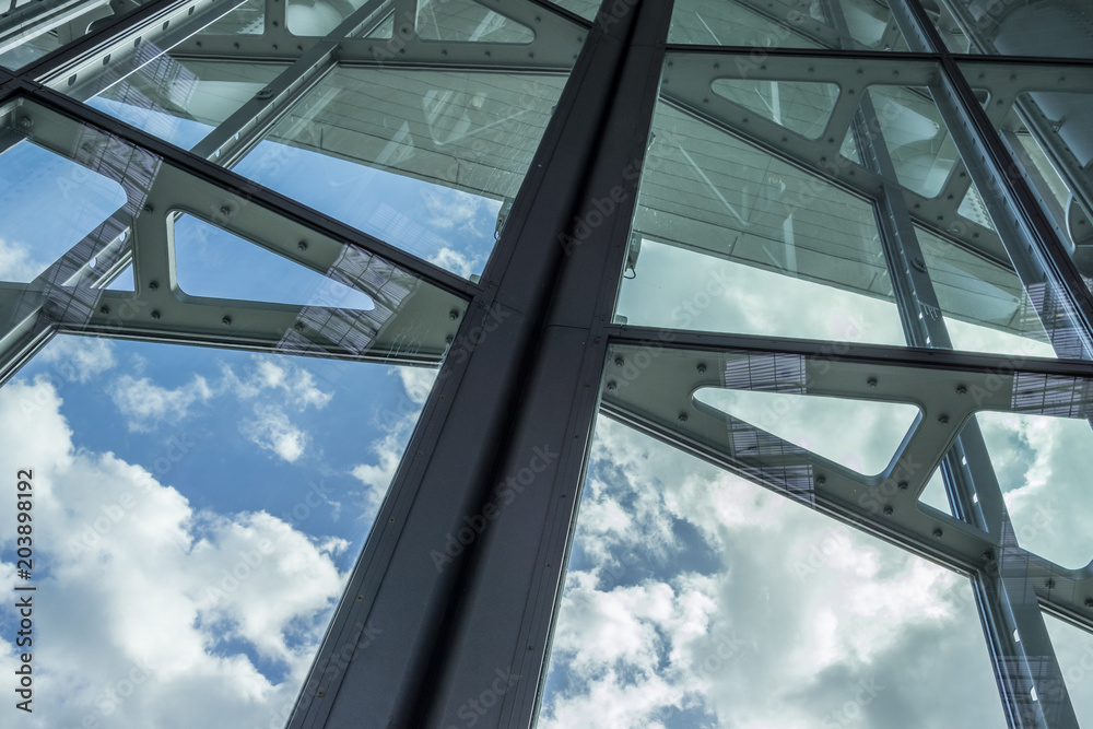 Sticker The glass architecture in city against a sky