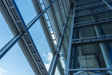 The glass architecture in city against a sky