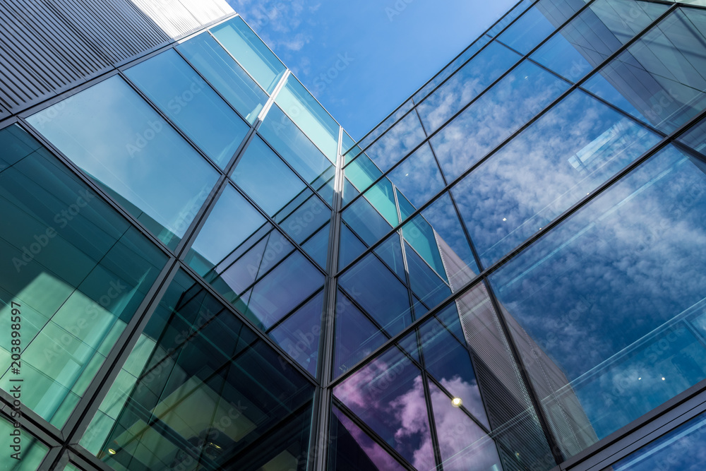 Wall mural The glass architecture in city against a sky