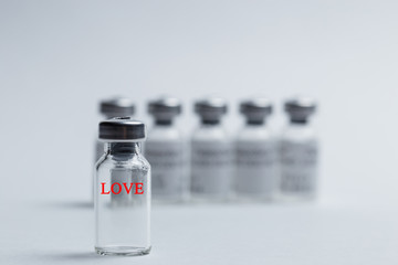 The inscription love in red letters on the vaccine