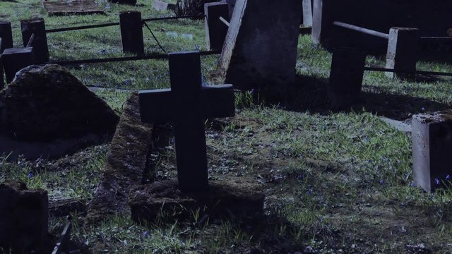 Walking at night in the old cemetery