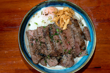 Beef Steak Donburi with egg and fried garlic