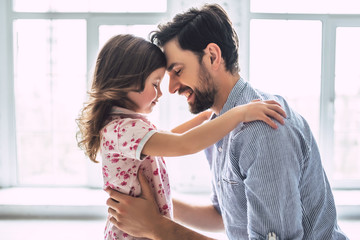 Dad with daughter at home