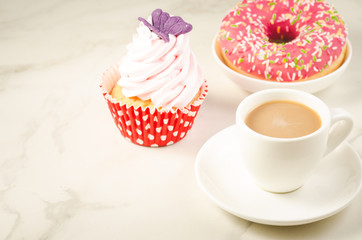 cappuccino white cup and fresh cake with butterfly/cappuccino white cup and fresh cake with butterfly on a white marble background. Selective focus and copyspace