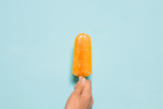 Orange ice cream popsicle