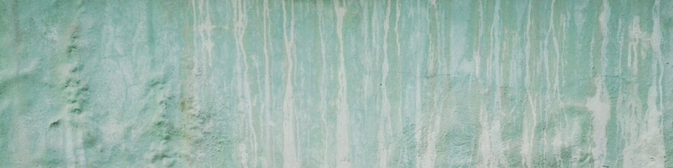 Turquoise vintage background. Dirty wall with water marks