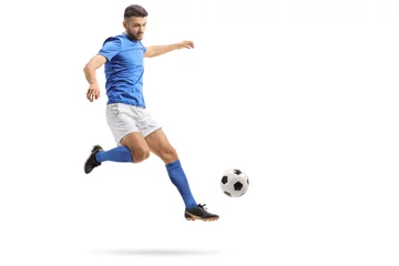 Foto op Aluminium Soccer player in mid-air kicking a football © Ljupco Smokovski
