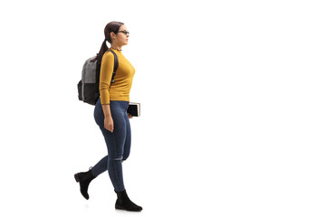 Female teenage student walking