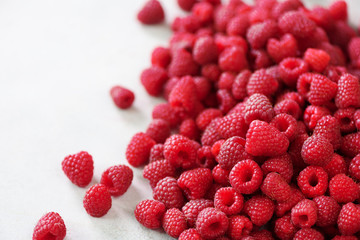 Fresh organic raspberries. Fruit background with copy space. Summer and berries harvest concept. Vegan, vegetarian, raw food.