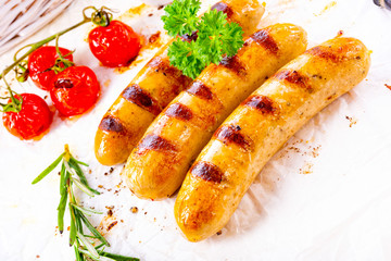 delicious bratwurst with ketchup and fresh rolls