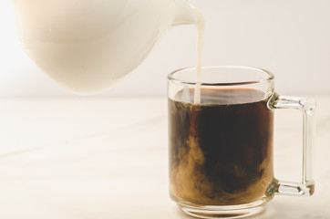Coffe glass with milk on white background/Coffe glass with milk on white background. Selective focus