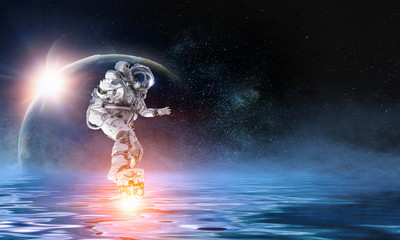 Obraz na płótnie Canvas Astronaut on board. Mixed media
