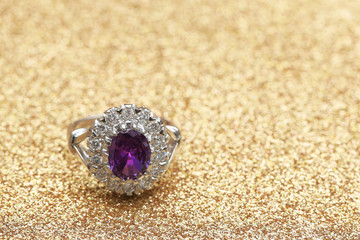purple gemstone on diamond ring