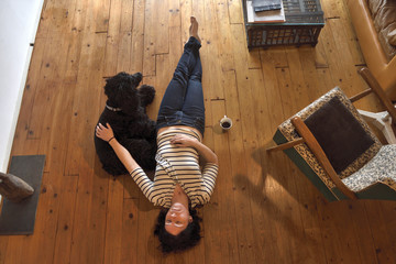 a woman lying on the floor of her house