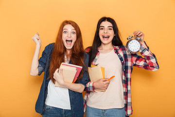 Portrait of two surprised young school teenage girls