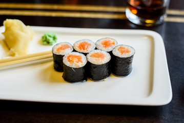 Fresh sushi rolls served on plate in restaurant